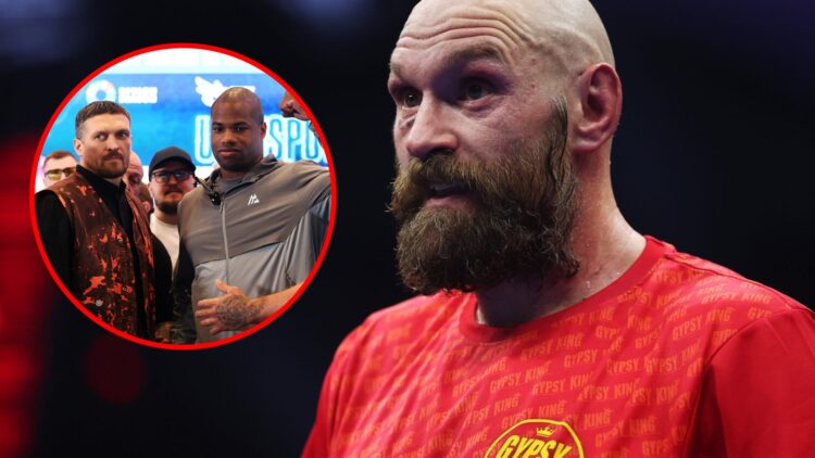 Tyson Fury looks on with a big beard and red tshirt on with inset of Daniel Dubois with a fist raised stood beside Oleksandr Usyk at their press co...