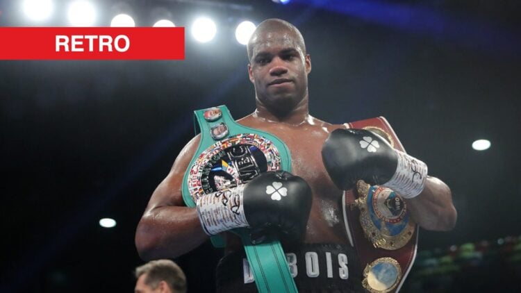 Daniel Dubois stands in the ring with a belt over his shoulder after a win