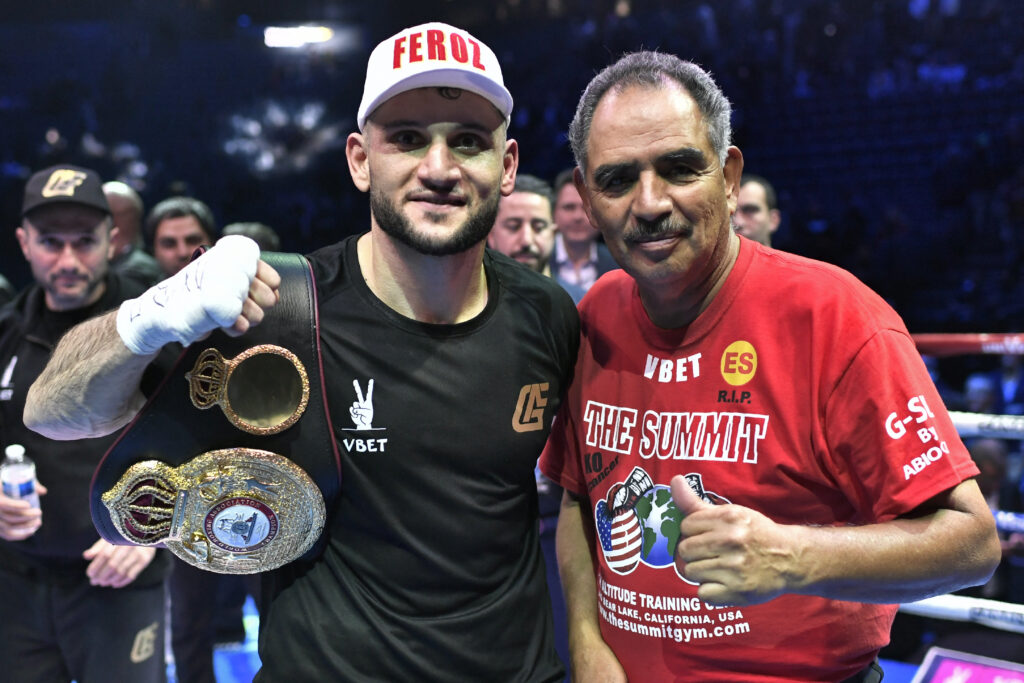 Abel Sanchez posing with a thumbs up alongside France's Arsen Goulamirian in ring