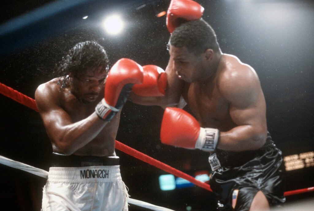 Mike Tyson hits Mitch Green with a right hand during their 1996 fight