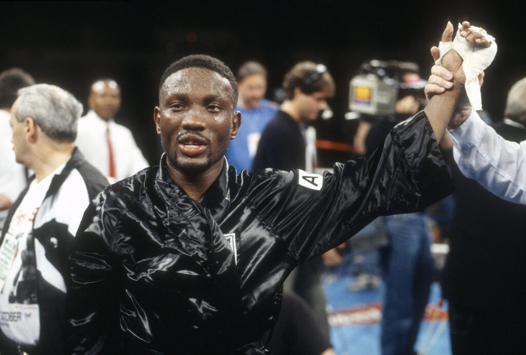Pernell Whitaker celebrates in the ring after his WBC welterweight title fight win over James McGrit in 1994