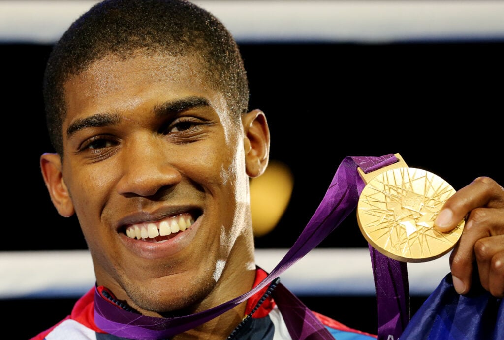 Anthony Joshua celebrates after his gold medal win over Roberto Cammarelle in the men's final