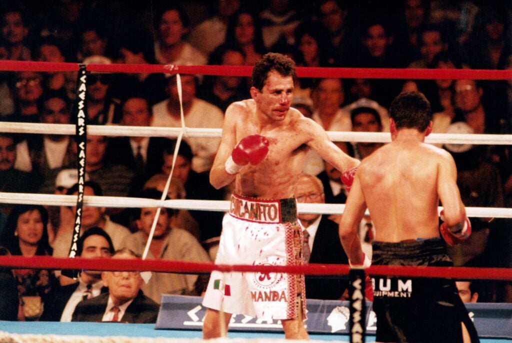 A bloodied Genaro Hernandez faces Oscar De La Hoya