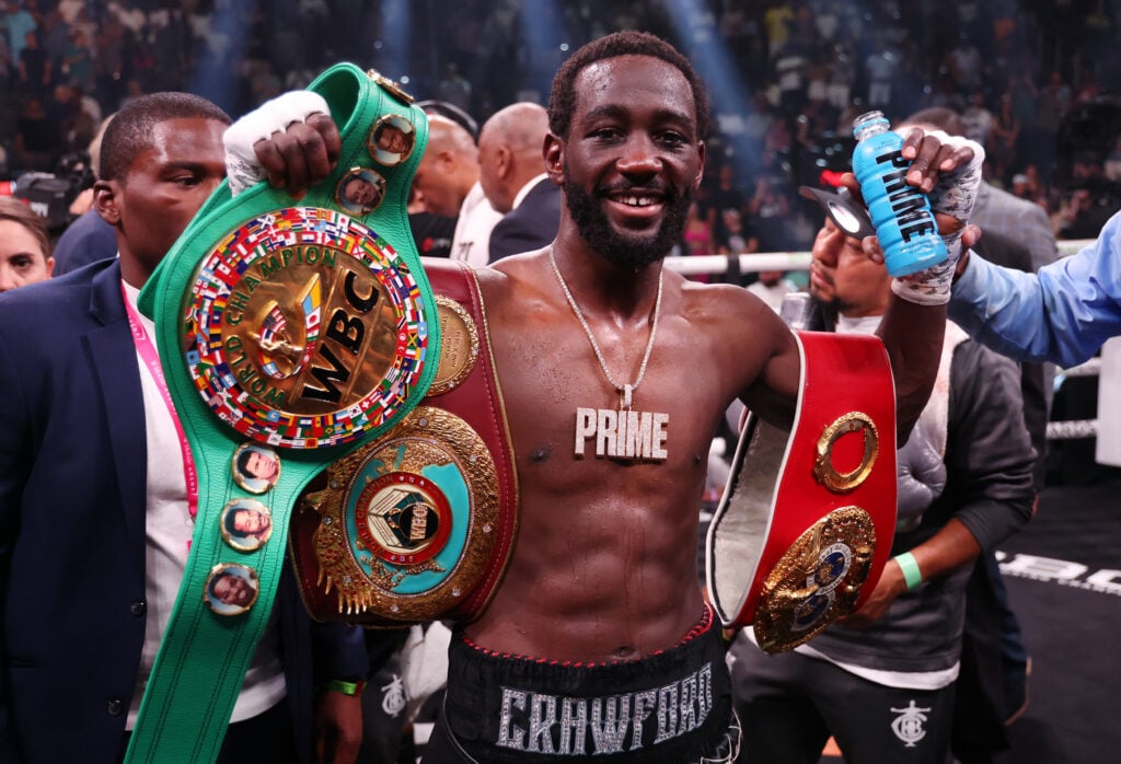 Terence Crawford celebrates in the ring after his undisputed welterweight title fight win over Errol Spence Jr. in July, 2023