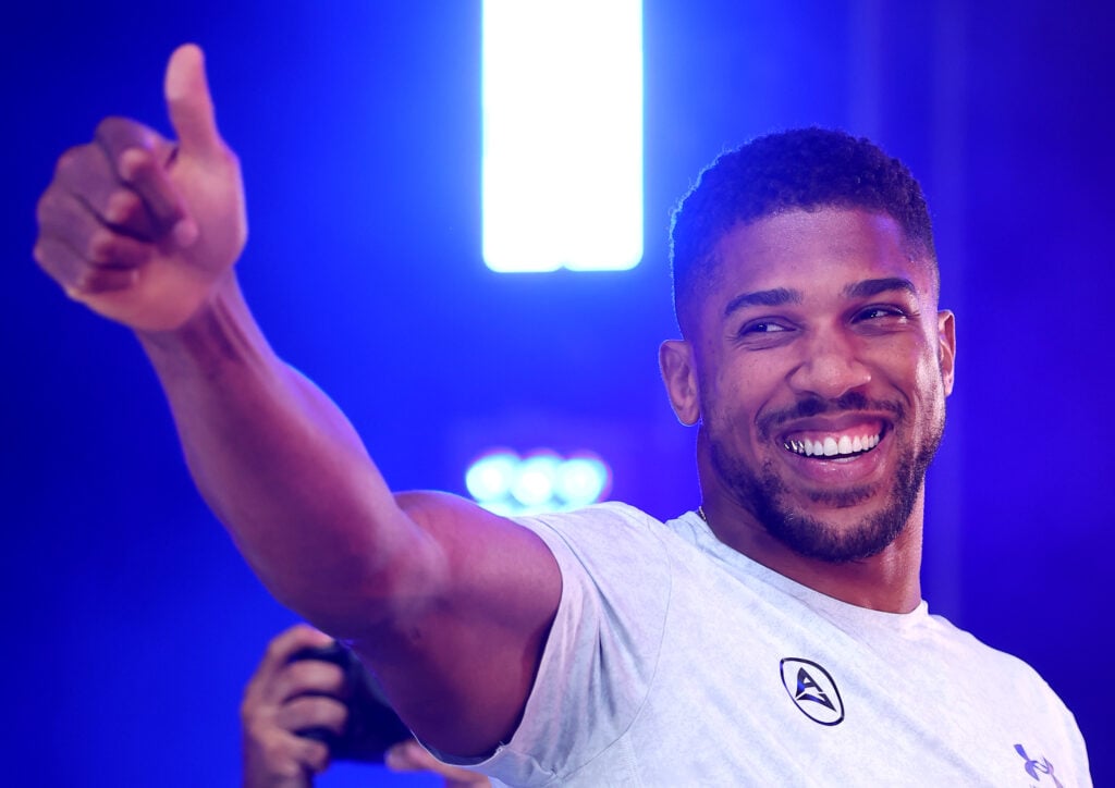 Anthony Joshua gestures to the crowd during the weigh-ins ahead of his IBO heavyweight title fight with Daniel Dubois