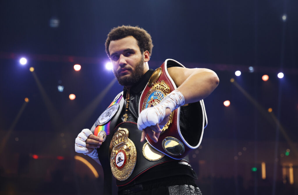 Moses Itauma posing with belts