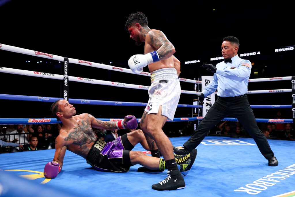 Joseph Lopez standing over his downed opponent Regis Prograis