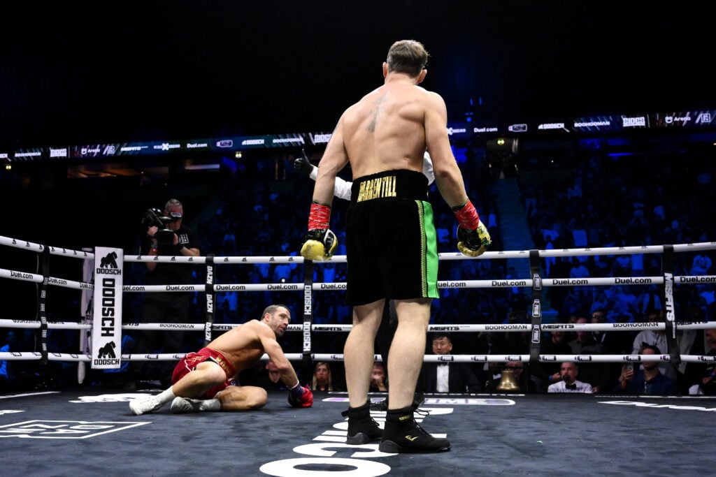 Darren Till looks on at a downed Luke Rockhold
