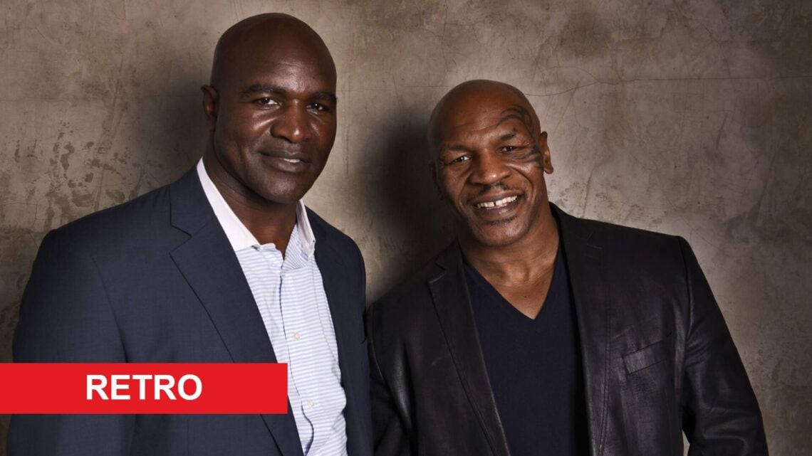 Evander Holyfield posing with Mike Tyson with retro label