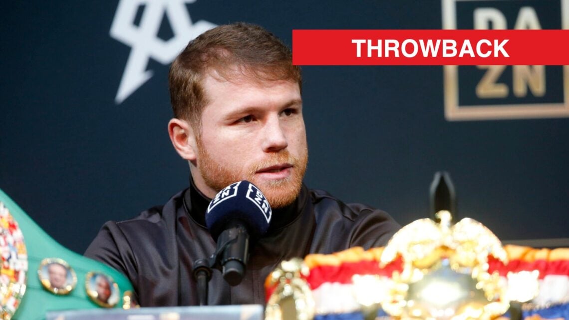 Image of Canelo Alvarez speaking at press conference with belts in foreground of photo with throwback label