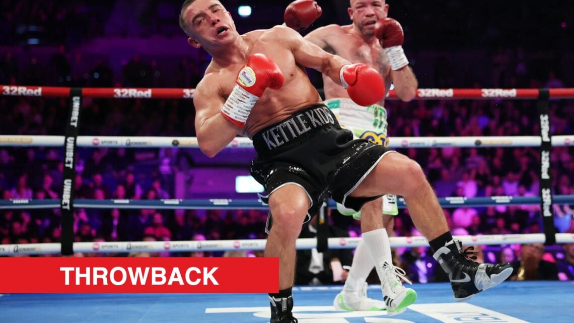 Image of Nick Ball stumbling in the ring with TJ Doheny looking towards him with throwback label