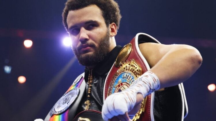 Close-up of Moses Itauma with belts over his shoulders