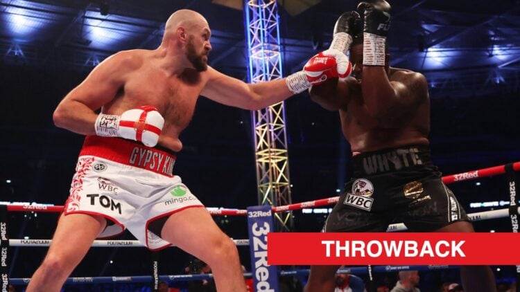 Tyson Fury punches Dillian Whyte who holds his hands up to block the punch