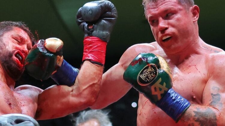 Canelo lands a left hook on the head of John Ryder