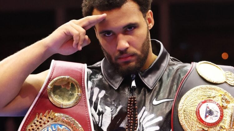 Itauma salutes with belts over his shoulders after KO of Dillian Whyte