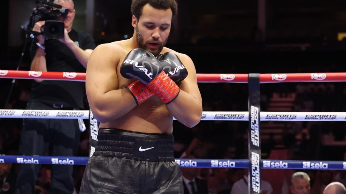 Itauma crosses his hands on his chest as he kneels in the ring after KOing Dillian Whyte