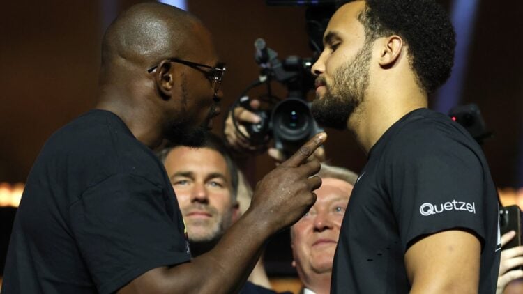Dillian Whyte points a finger at Moses Itauma during their face-off