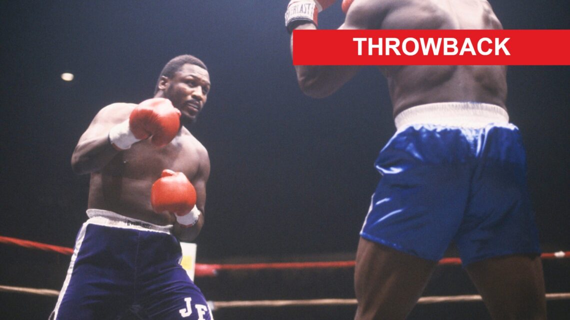 Joe Frazier sizes up his opponent during a boxing match