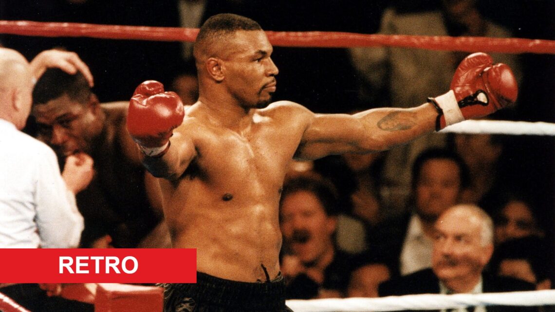 Mike Tyson celebrates in the ring after a knockout win.