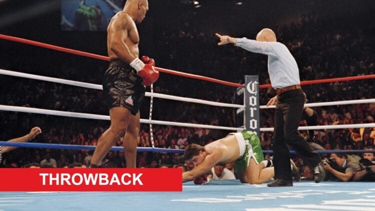 Mike Tyson stands over Peter McNeeley after knocking him down in his first fight since prison