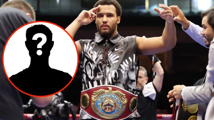 Moses Itauma salutes as his arm is raised following his knockout win over Dillian Whyte