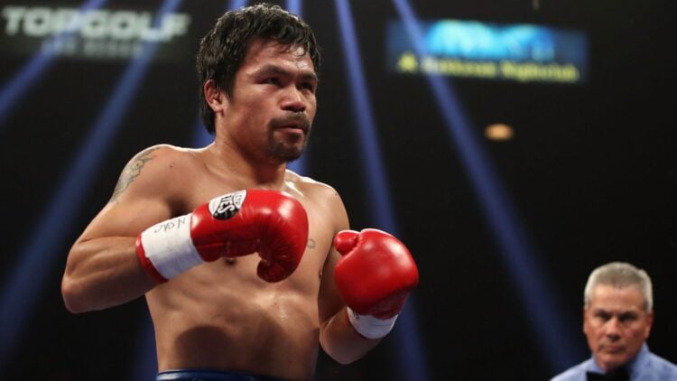Manny Pacquiao in the ring against Mario Barrios