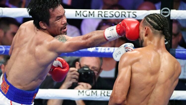 Manny Pacquiao lands a straight left hand on Keith Thurman
