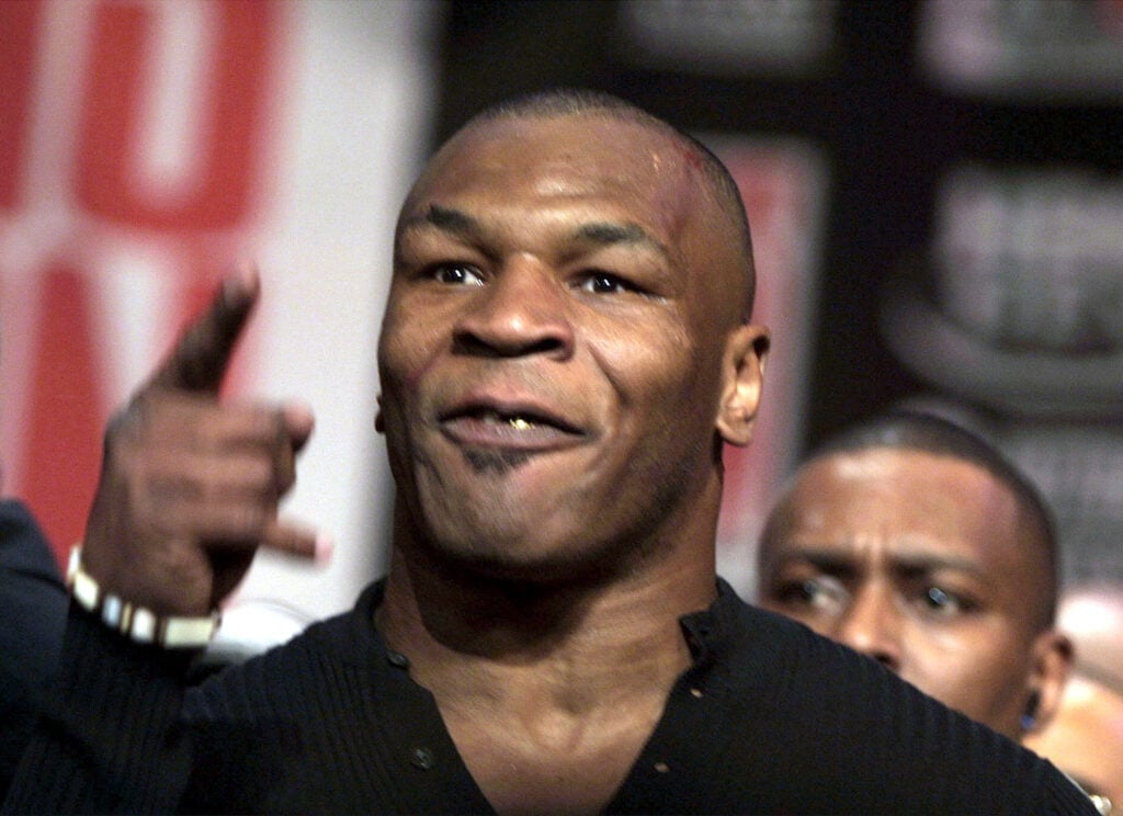 MIke Tyson yells at a reporter after a brawl with Lennox Lewis