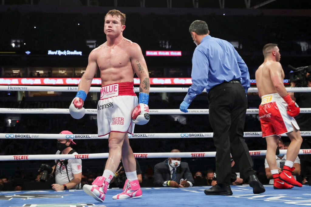 Canelo Alvarez and Avni Yildirim walk away from each other at the end of the round