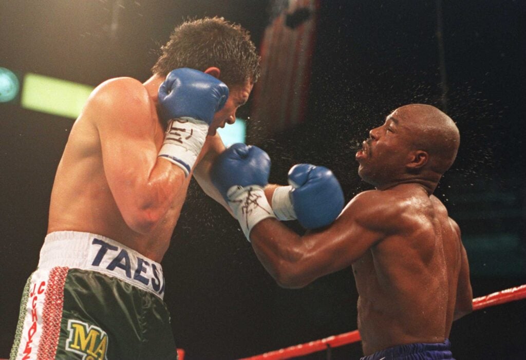 Julio Cesar Chavez punching Meldrick Taylor