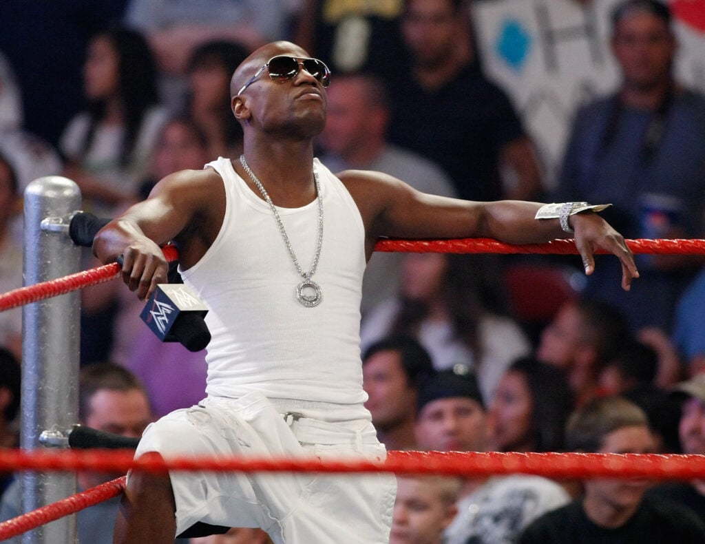 Floyd Mayweather leans on the ropes during a WWE appearance